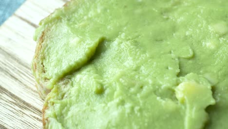 avocado spread on a chopping board ,