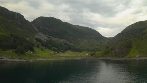 norwegian lake and mountains in maloy, vestland county, norway - aerial drone shot