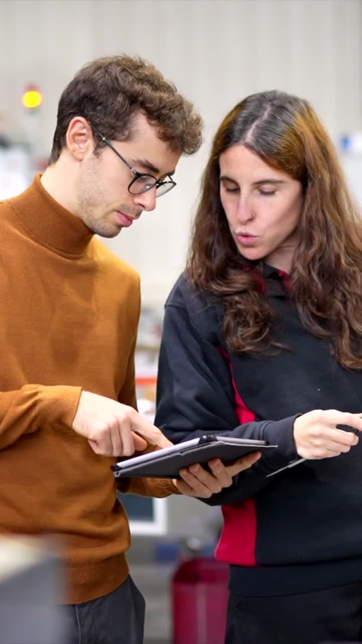 People looking at a tablet