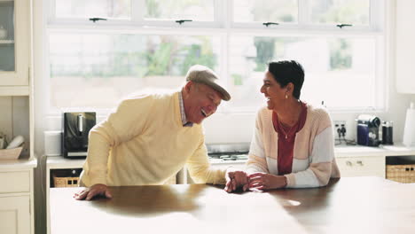 Laughing,-kitchen-and-senior-couple