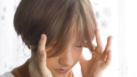 teenage girl rubs the gas with her hands.
