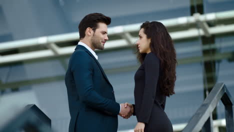 romantic couple looking at each other outside