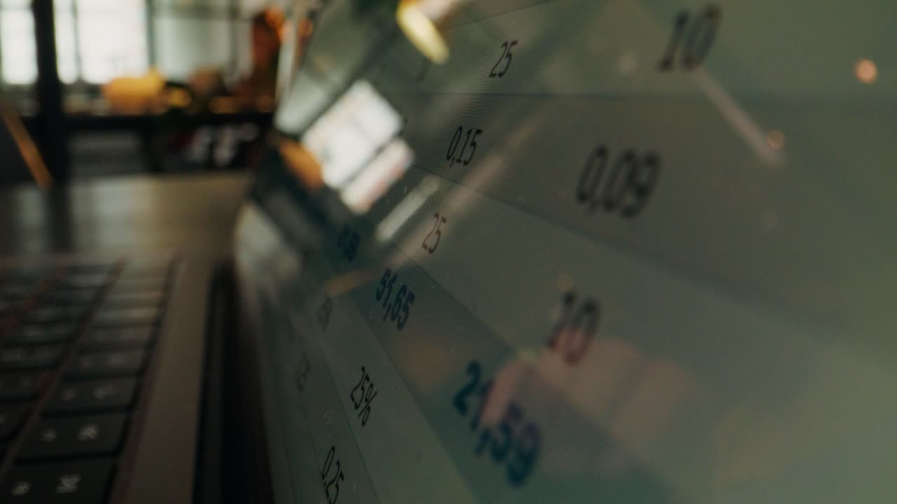 Close-up of a laptop screen displaying numerical data.
