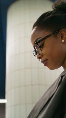 close-up of a woman wearing glasses