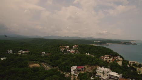 Aerial-over-coastline-of-Huatulco,-Mexico