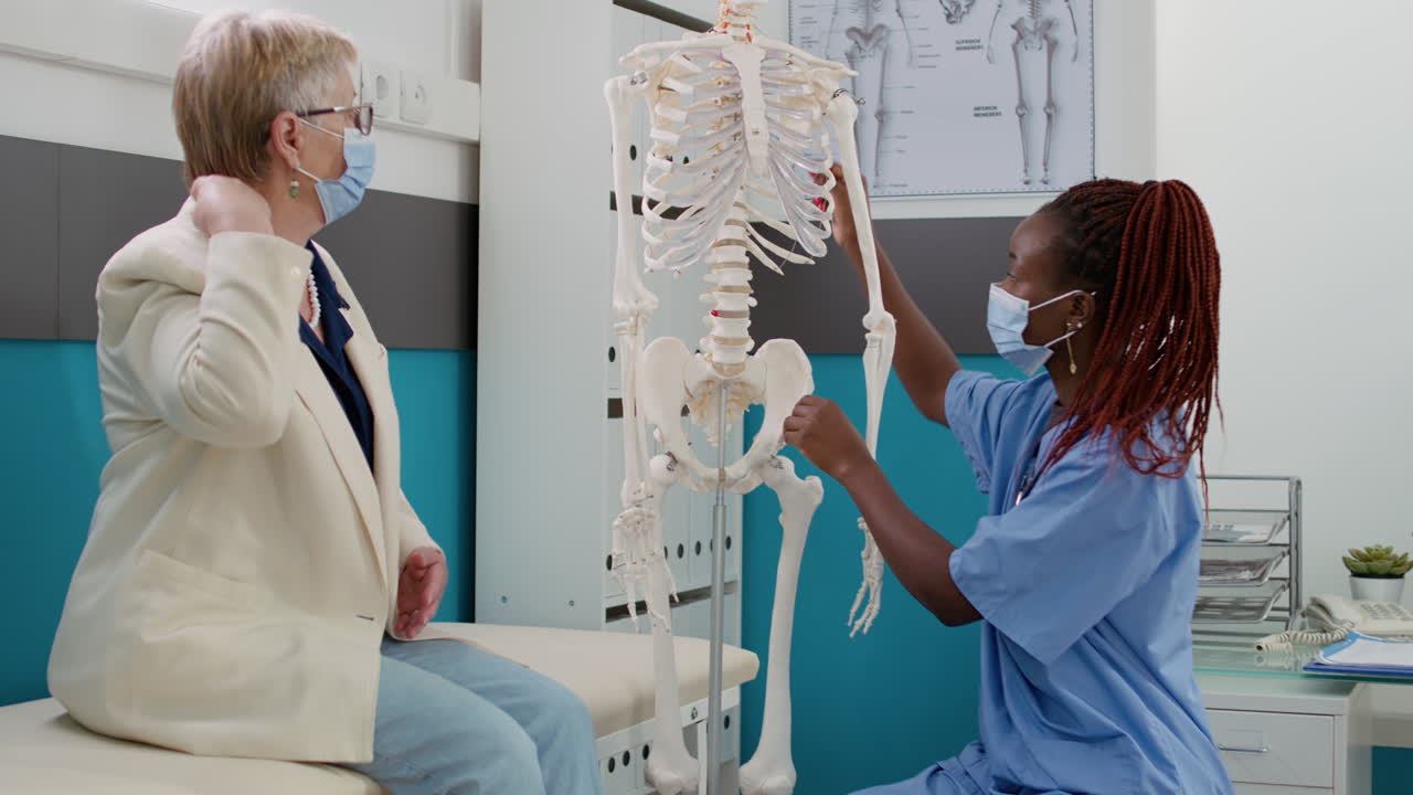 Medical consultation with skeleton anatomy