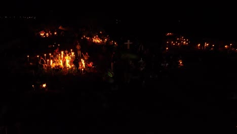 drone: dolly in shot of pacanda island graveyard at day of the death in patzcuaro lake