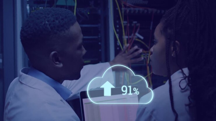 Animation of cloud with uploading over african american man working on laptop in server room