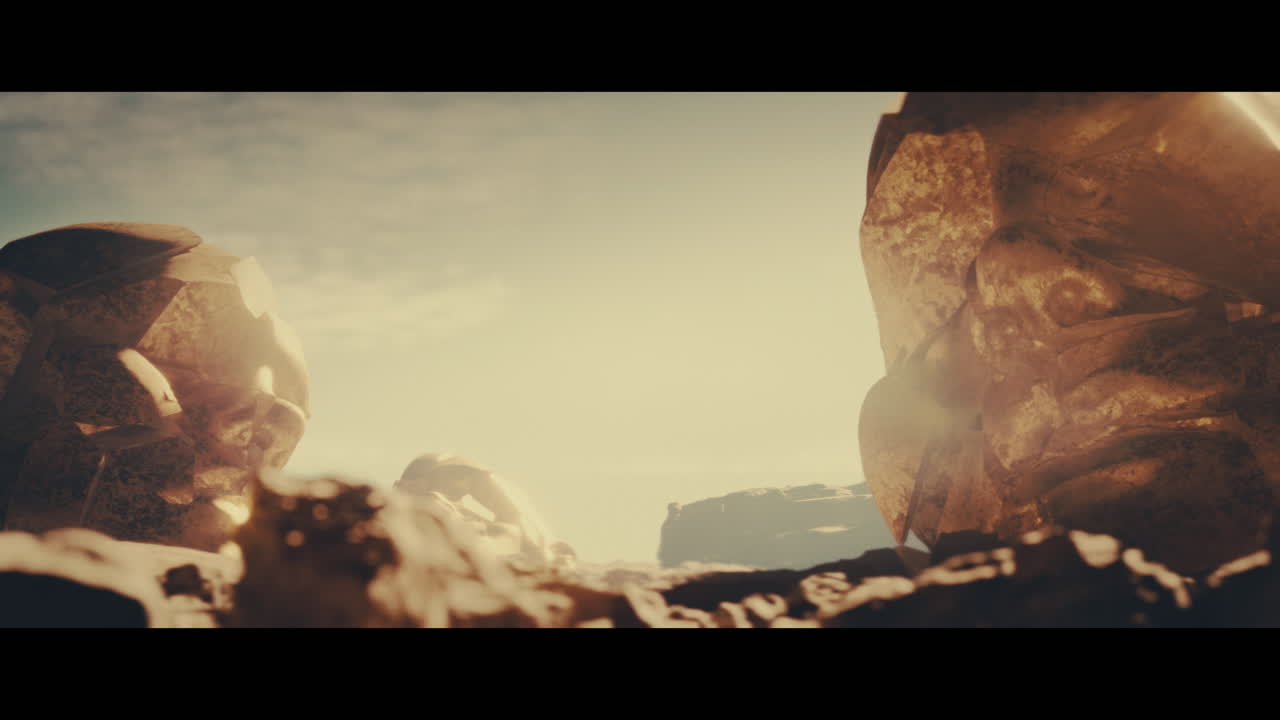Huge golden statues in the desert during sunset