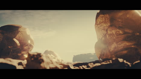 huge golden statues in the desert during sunset