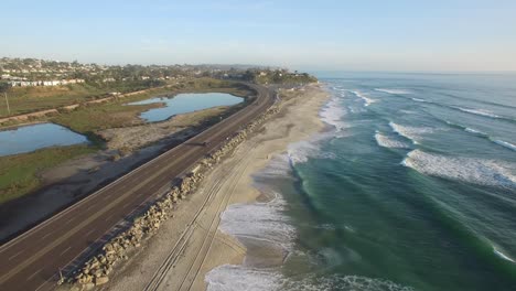 high aerial over the california coastline and highway near san diego