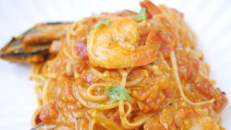 plate of sea food pasta on table