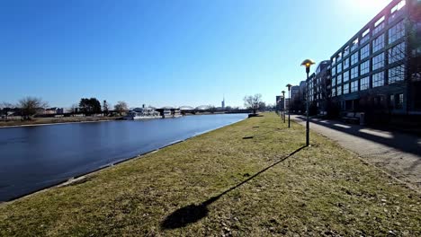 a river daugava with a bridge in the background