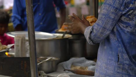 vendor preparing traditional indian street food