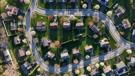 orbit establishing aerial shot of sprawling neighborhood with many homes in usa