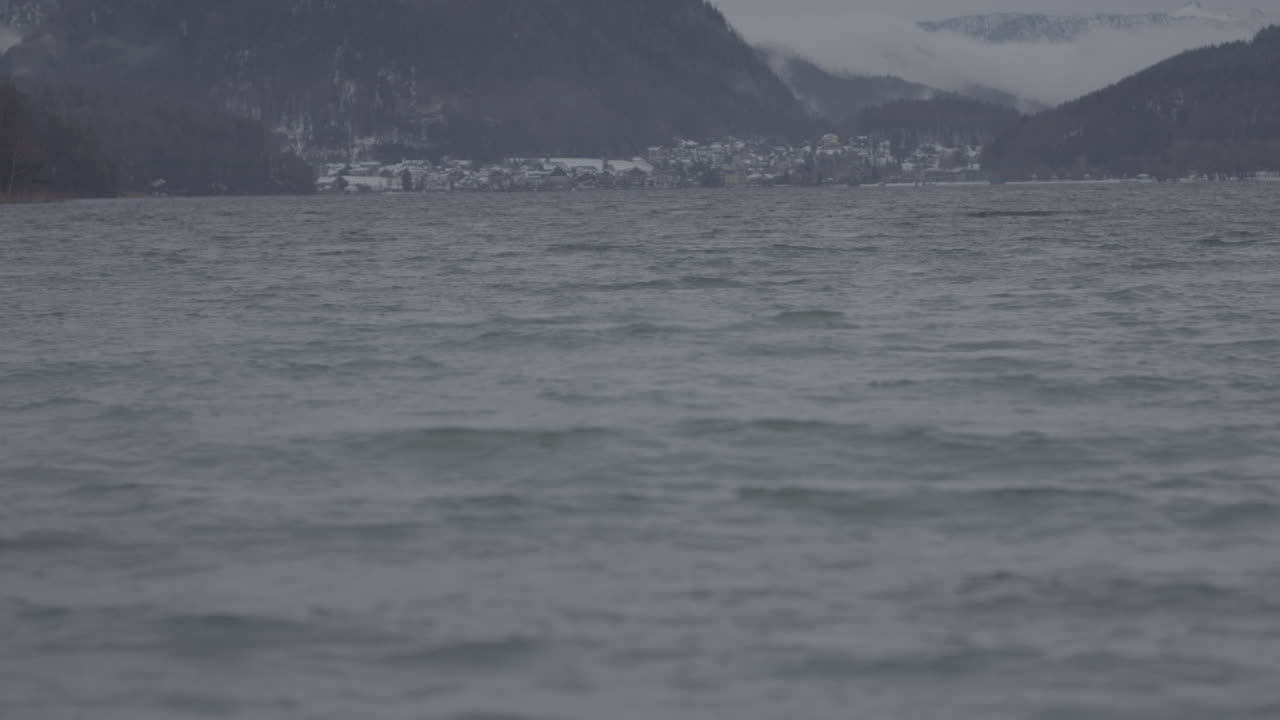 Winter Landscape of a Lake with a Town