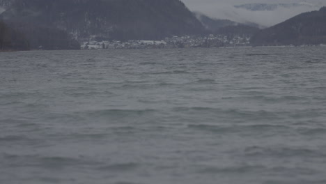 Winter Landscape of a Lake with a Town