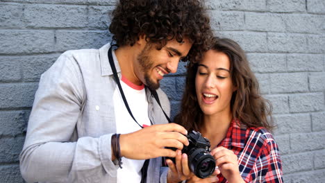 friends looking at pictures on camera
