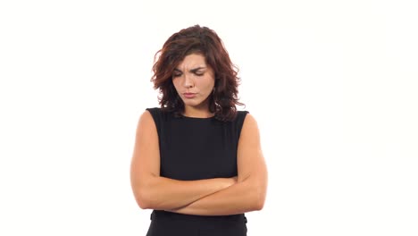 Displeased-upset-young-woman-crossing-her-arms-and-looking-in-the-camera-isolated-on-white-background