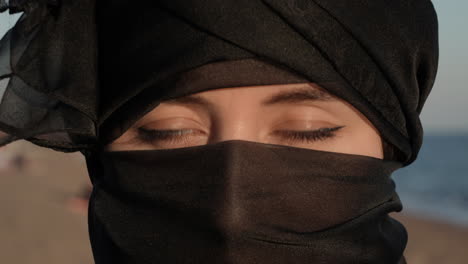 Beautiful-Muslim-Woman-in-Hijab-Open-Her-Green-Eyes-Looking-at-Camera,-Dramatic-Close-Up