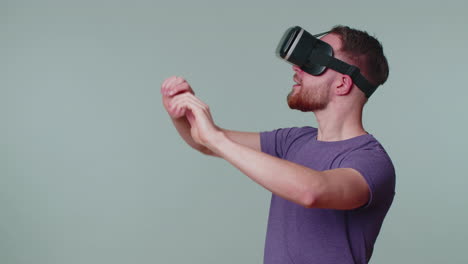 Man-using-virtual-reality-futuristic-technology-VR-headset-helmet-to-play-simulation-3D-video-game