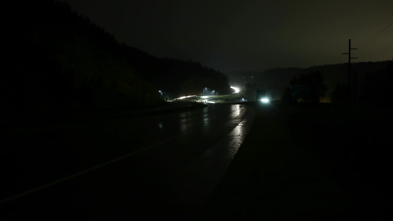 Dark winding wet freeway - 4K time lapse