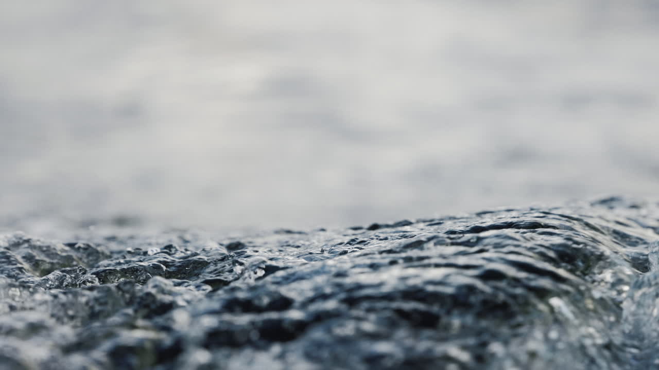 close up of ripples on the water surface behind boat