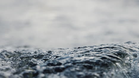 close-up-of-ripples-on-the-water-surface-behind-boat