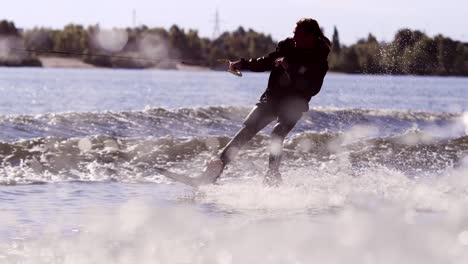 wake boarding rider enjoy training. surfer making trick on wakeboard