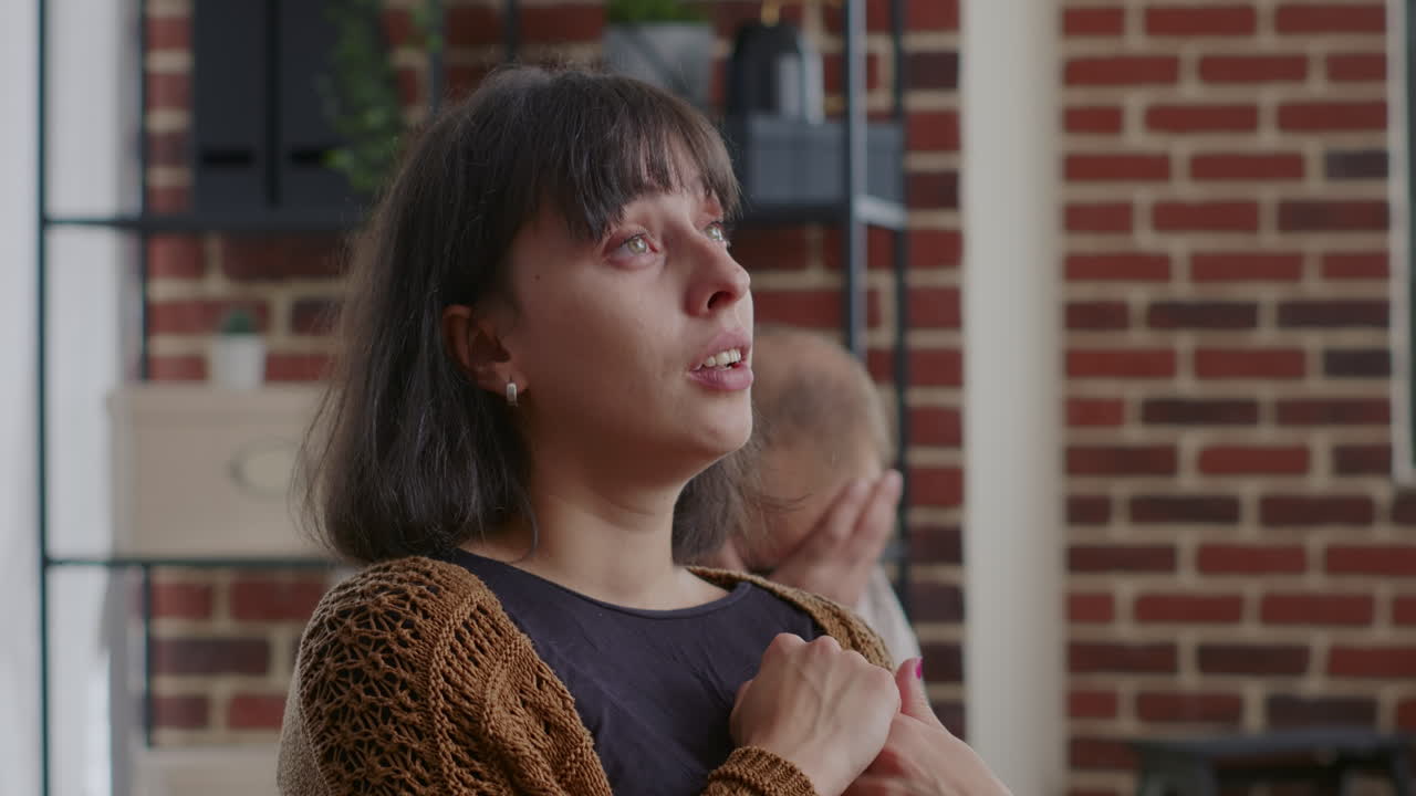 Close up of woman crying and sharing story about alcohol addiction at group therapy