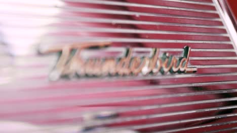 close-up of a vintage ford thunderbird emblem