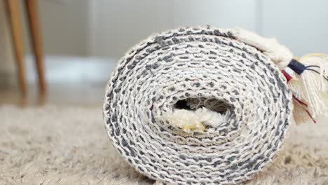 Close-up of a Rolled-up Handmade Rug