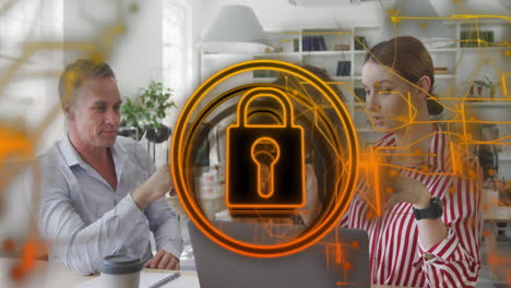 animation of security padlock icon against group of diverse colleagues discussing at office