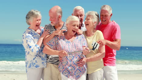 senior friends taking selfie