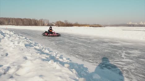 kid go-karting on frozen lake