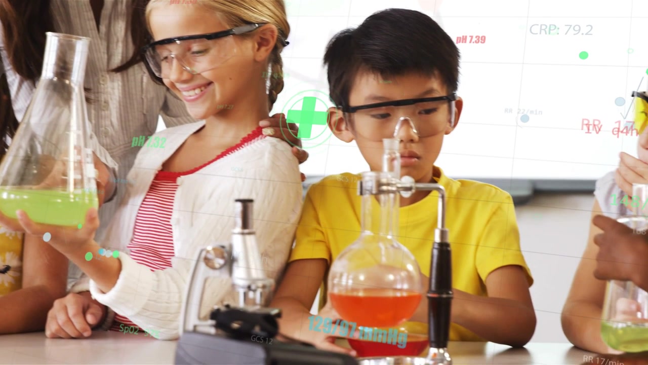 Teacher placing hand on student shoulder, guiding science class comparing colored flasks with scope