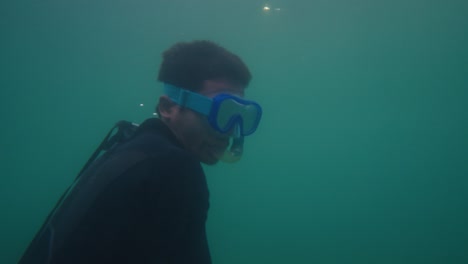 man snorkeling underwater