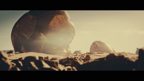 Huge golden statues in the desert during sunset