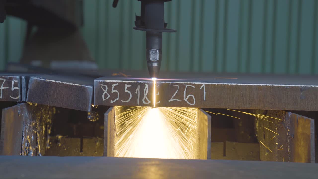 Sheet metal working with CNC plasma cutter machine. Cutting a thick metal plate. Closeup