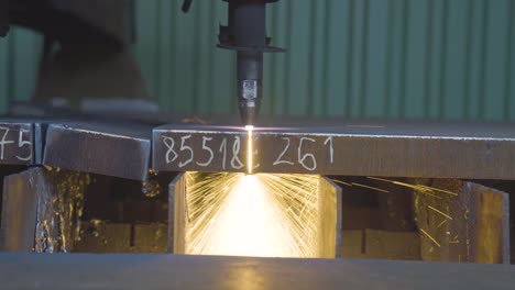 sheet metal working with cnc plasma cutter machine. cutting a thick metal plate. closeup