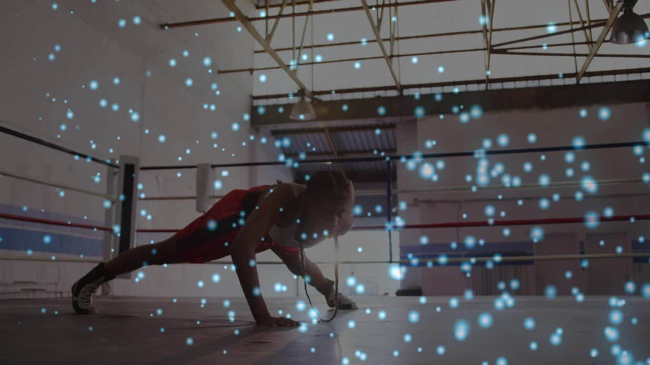 Boxer doing side plank in ring reaching shifting torso blue particles appearing over frame training