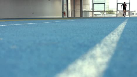 Man-racing-on-indoor-track