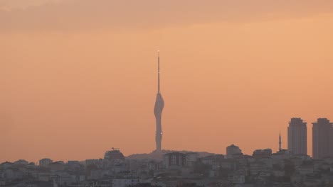 sunset over the city with a tower