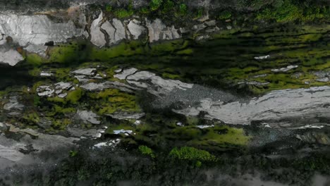 bird’s eye view ascending shot, scenic view of grass, landscape and river in la purisima baja california sur, mexico