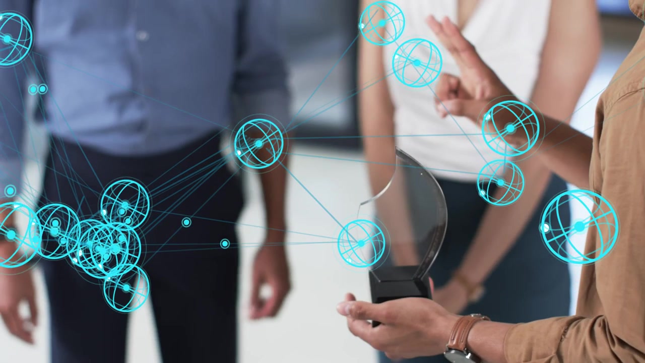 Presenter holding curved screen, gesturing, team watching, cyan nodes responding for tech demo