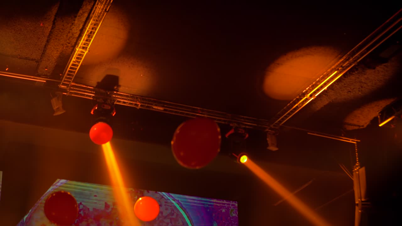 Colorful bright orange concert lighting equipment for stage at nightclub