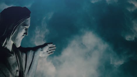 close up of jesus statue with thunderstorm background