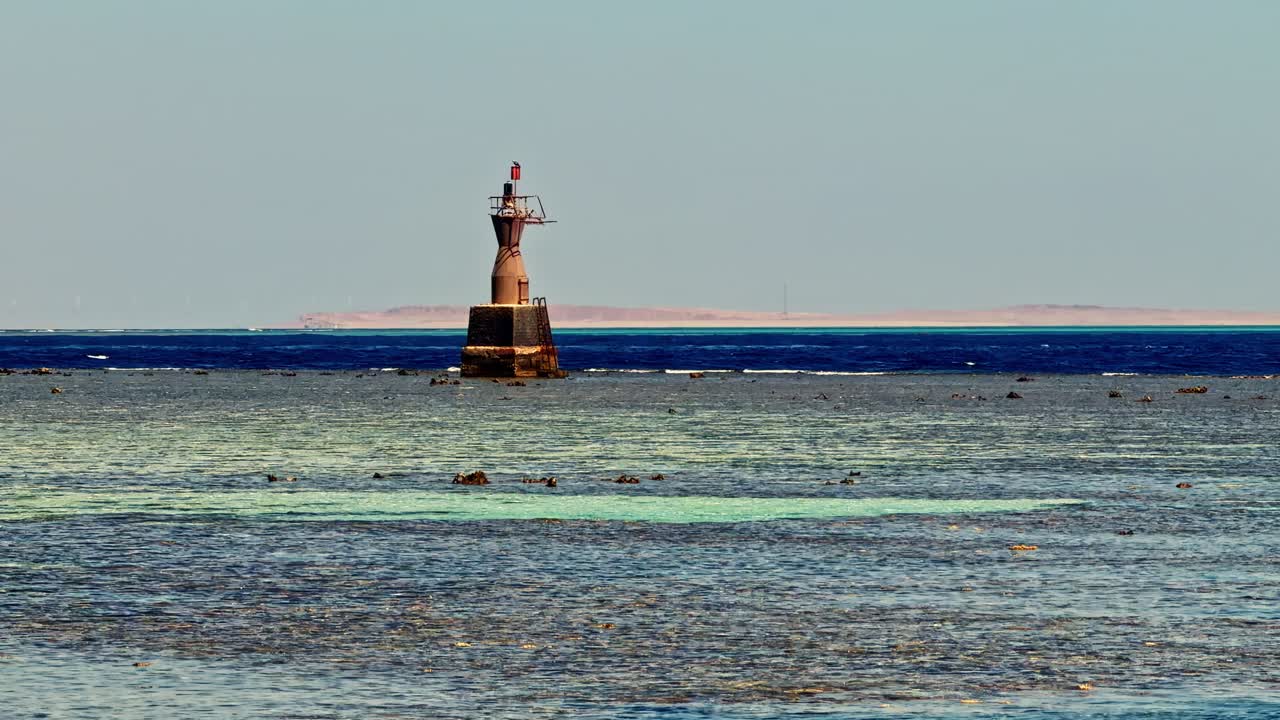 Sharm El Sheikh, Egypt - A Lone Beacon Stands Quietly in the Shallow, Crystal-colored Waters, Guiding Boats Across the Sea - Medium Shot
