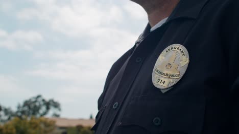 high rise video of a police sergeant in america using his radio and calling for additional units to the scene of a large scale and deadly crash