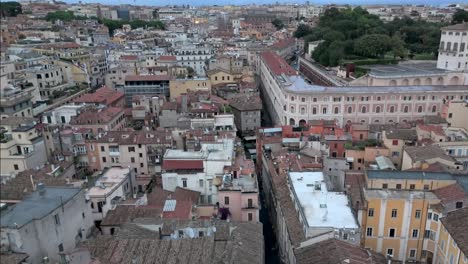 aerial descending down over old neighborhood in rome, italy during early morning